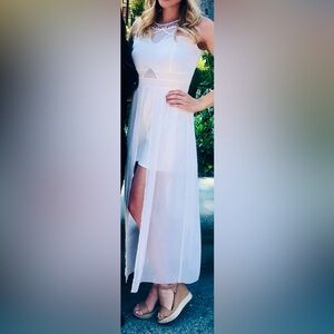 Elegant White Sleeveless Romper with Sheer Overlay Skirt